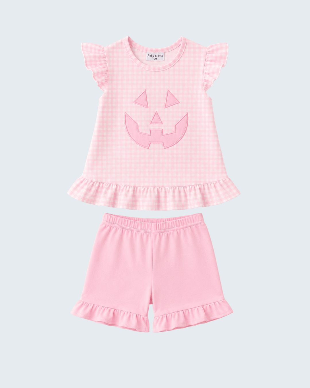 Pink gingham ruffle top and shorts set with jack-o-lantern applique