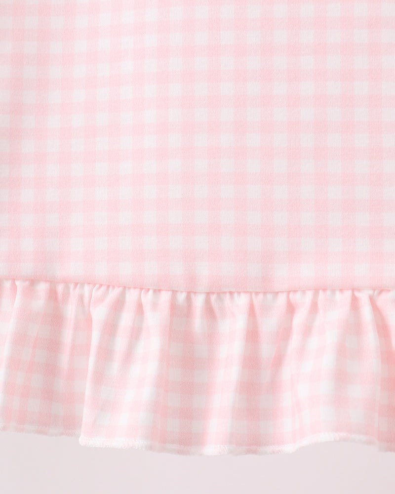 Pink gingham top with gathered ruffle hem