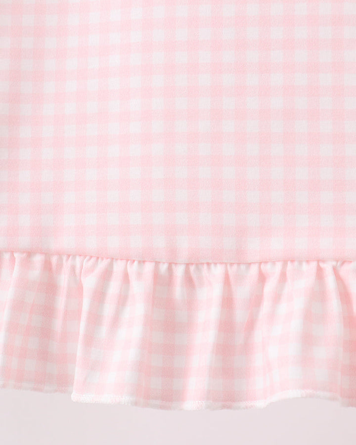 Pink gingham top with gathered ruffle hem