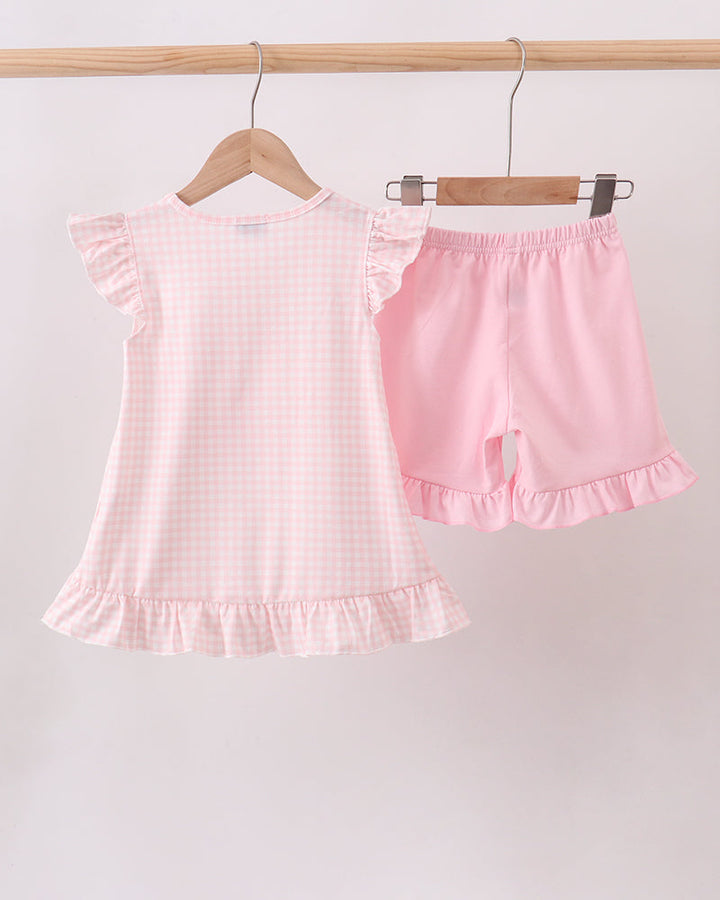 Pink gingham ruffle top with flutter sleeves and matching shorts, jack-o-lantern applique