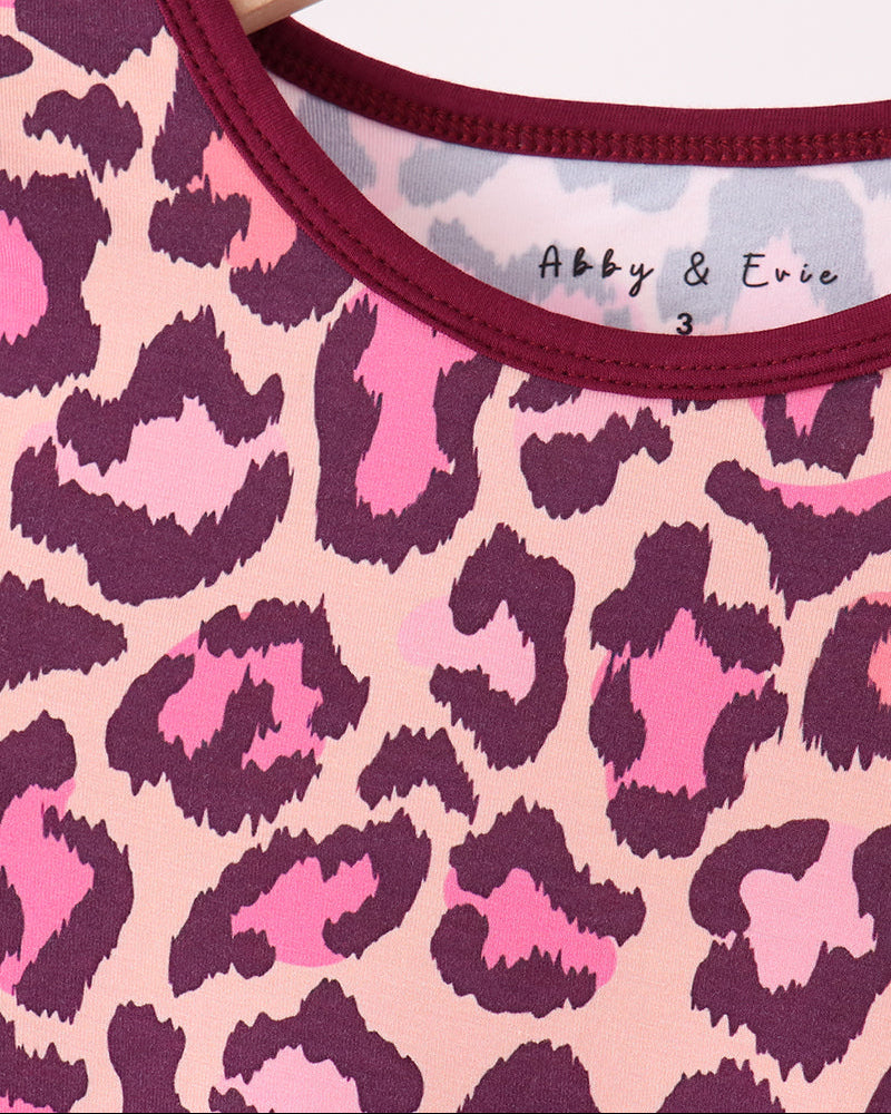 Pink leopard pajama top neckline with dark plum ribbed trim