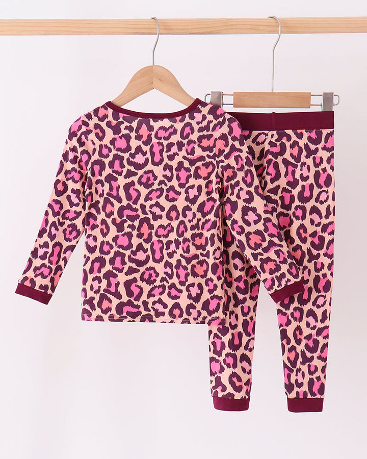Pink leopard long-sleeve pajama set with matching pants and dark plum trim