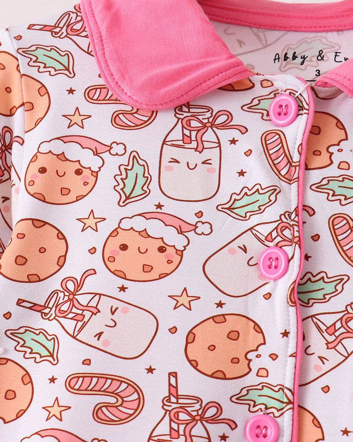 Cookie print pajama top with pink collar, button placket, and ruffled cuffs.