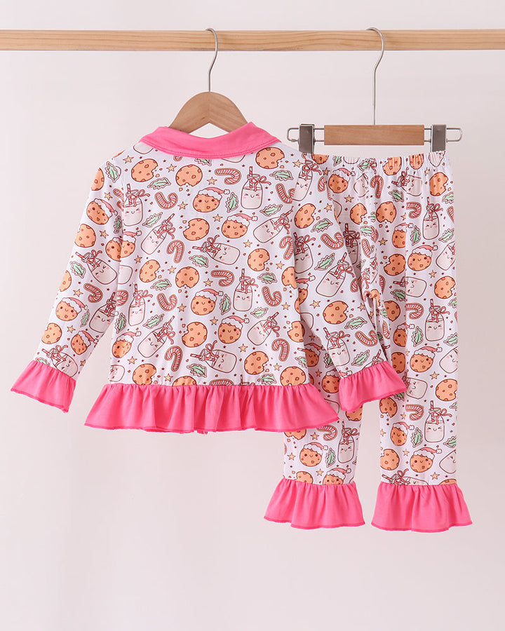 Cookie print long-sleeve pajama set with pink ruffled cuffs and matching pant legs.