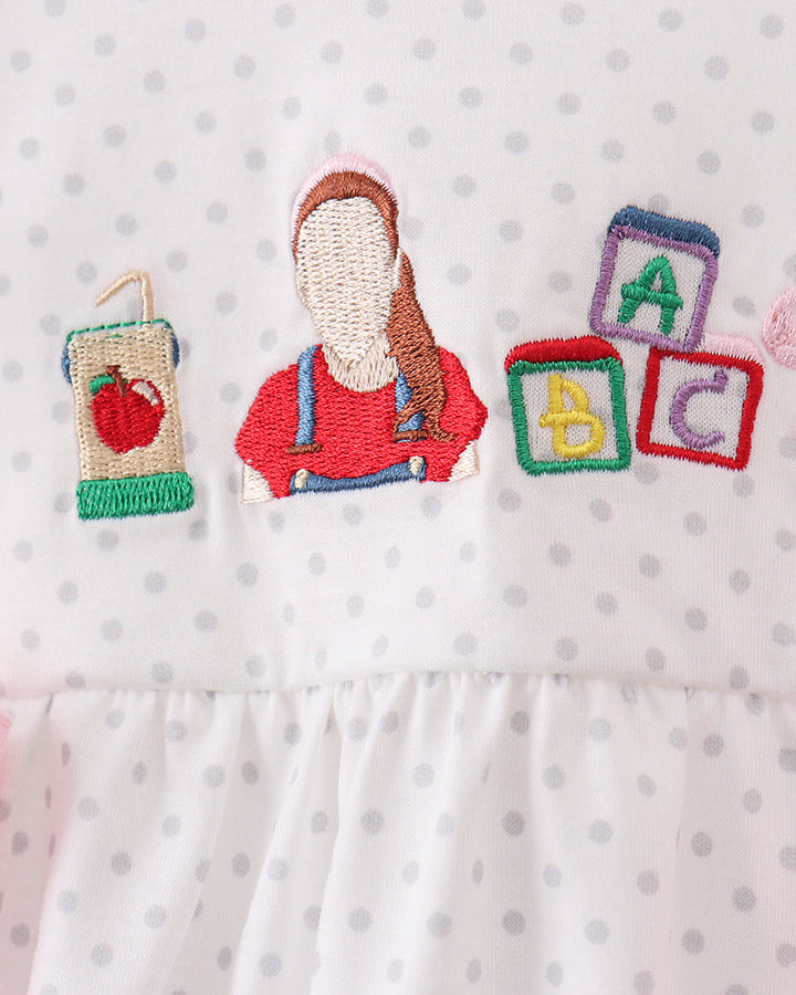 Pink dot baby bubble romper with ABC block embroidery and doll applique