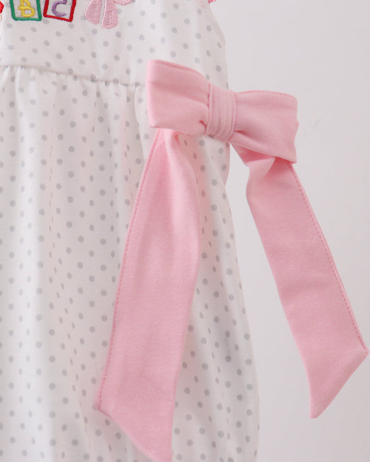 Pink bow detail on dot baby bubble romper bodysuit