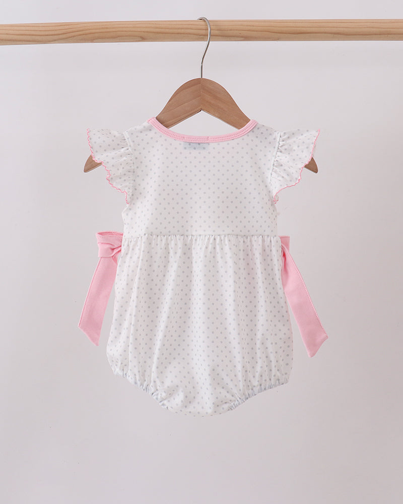 Pink dot baby bubble romper with short flutter sleeves and side bow ties