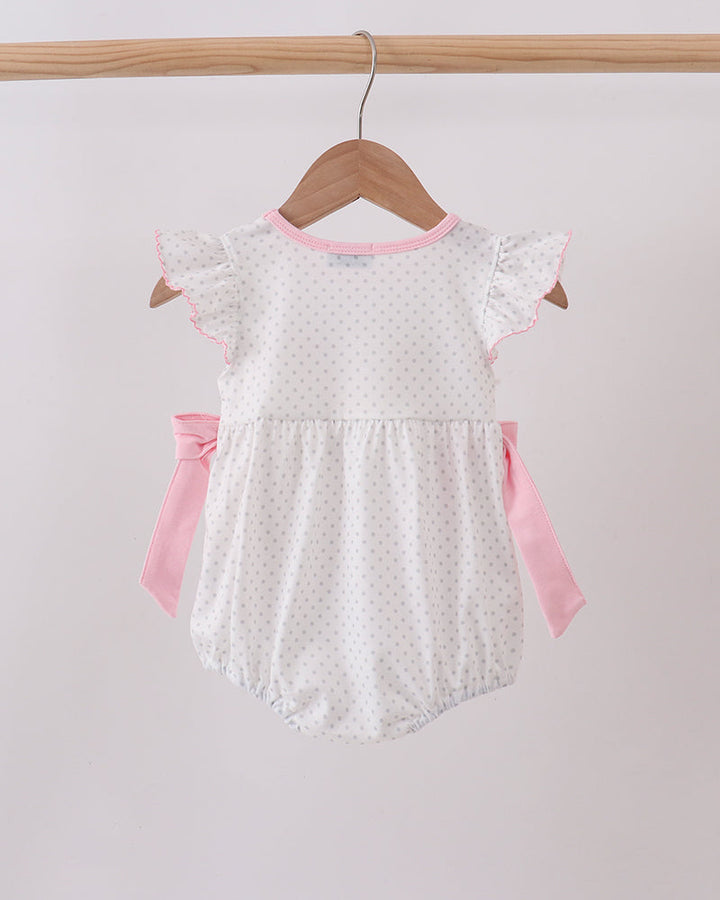 Pink dot baby bubble romper with short flutter sleeves and side bow ties