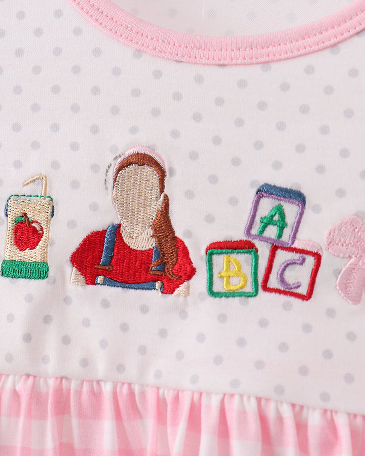 Pink gingham bloomer set top with ABC embroidery, pink trim, and ruffled hem