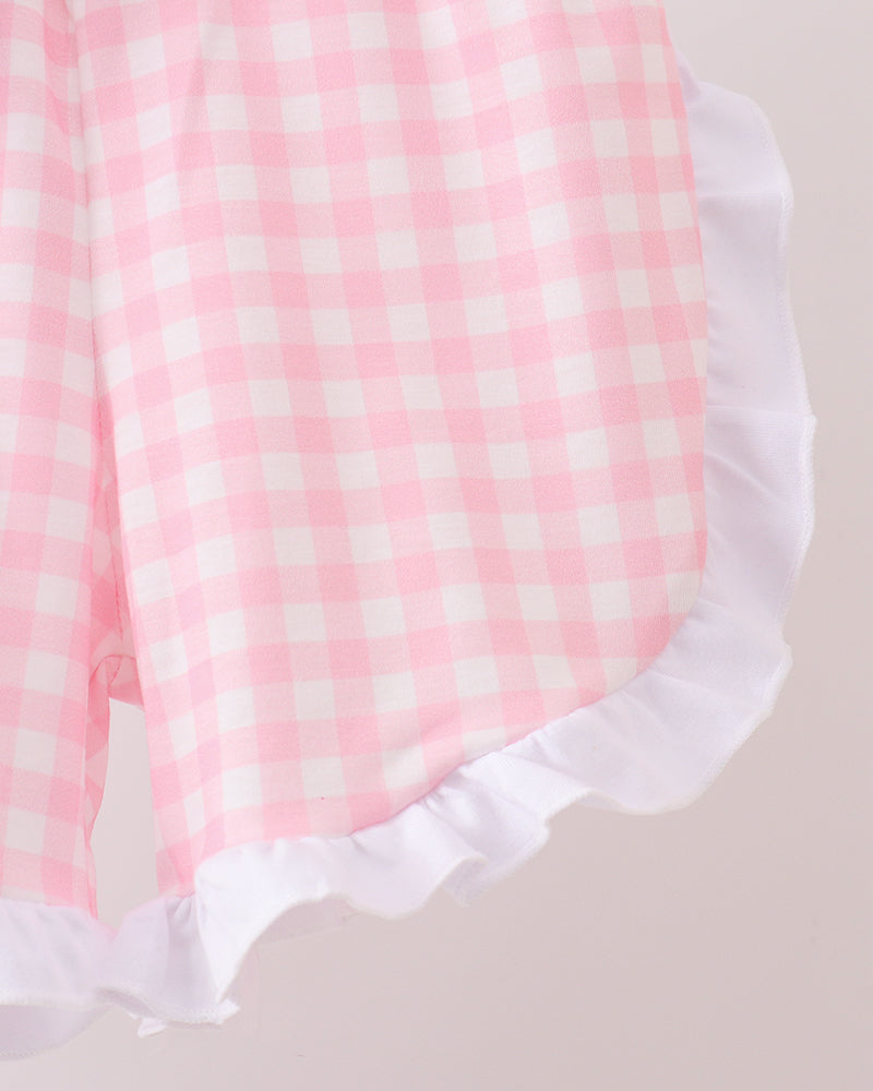 Pink gingham ruffle shorts with white ruffled hem and elastic waistband