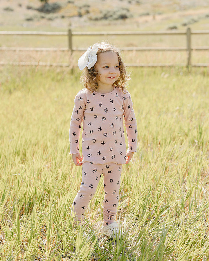 Pink flower-print cotton pajama set on toddler, long-sleeve top and matching pants