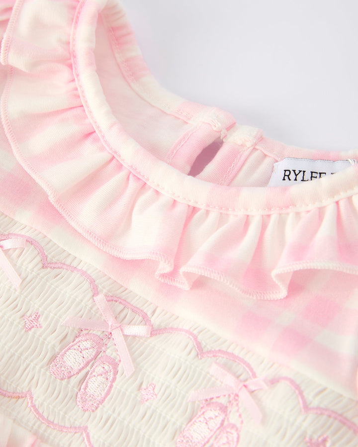 Pink plaid romper with layered ruffle collar and heart-style embroidery on chest