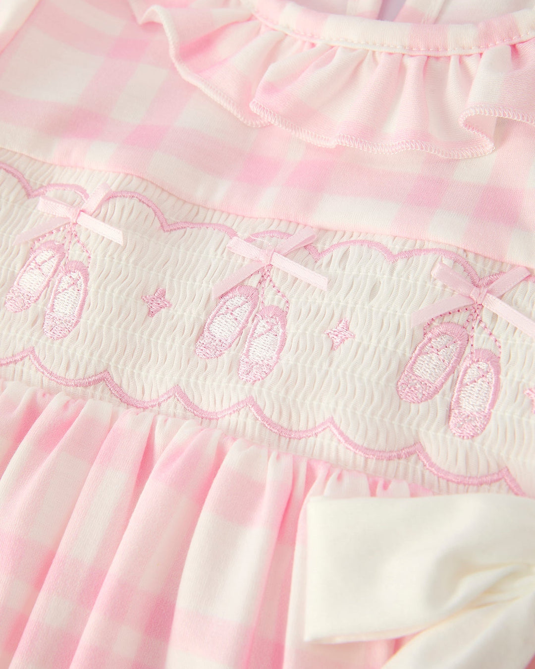 Pink plaid dress bodice with smocked embroidery and scalloped ruffle trim
