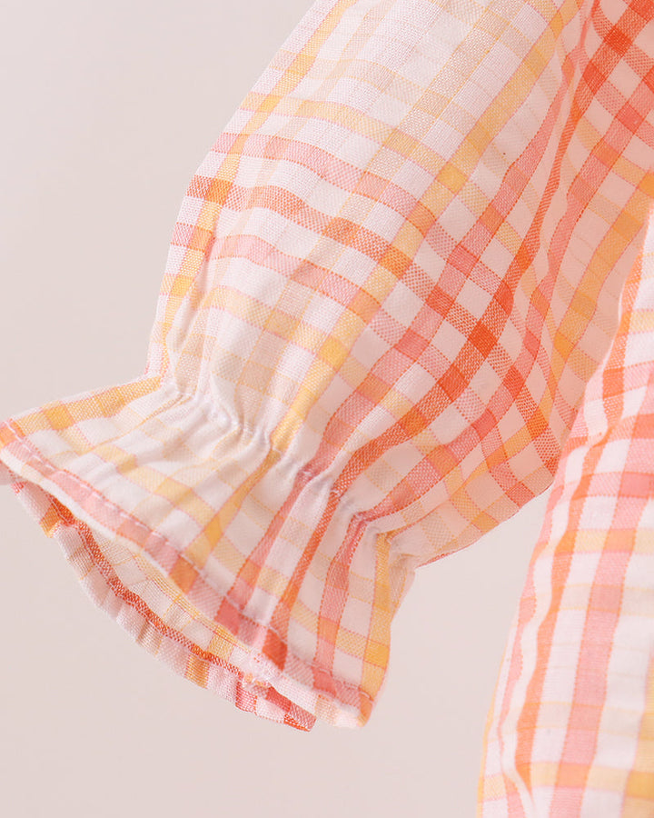Plaid bubble romper sleeve with flutter cuffs and ruffled hem trim