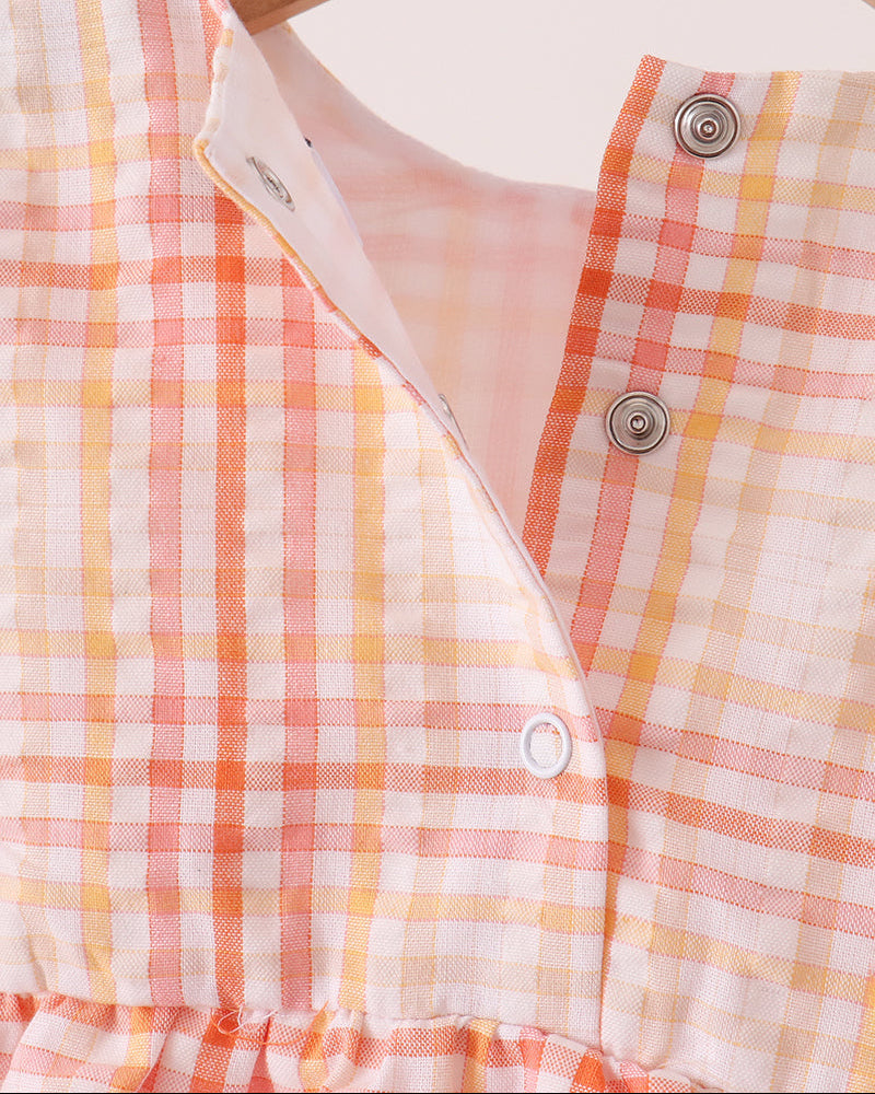 Plaid bubble romper neckline with V-slit and button placket with snap closures