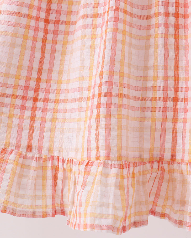Pink-and-orange plaid dress with tiered ruffle hem and gathered skirt