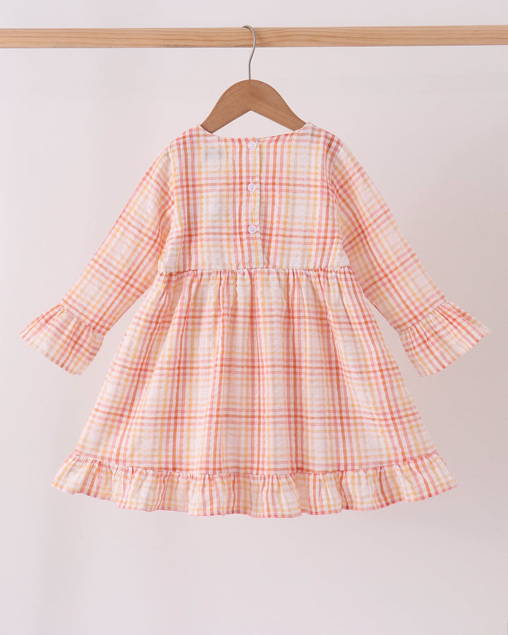 Pink-and-orange plaid long-sleeve dress with button placket and tiered ruffle skirt
