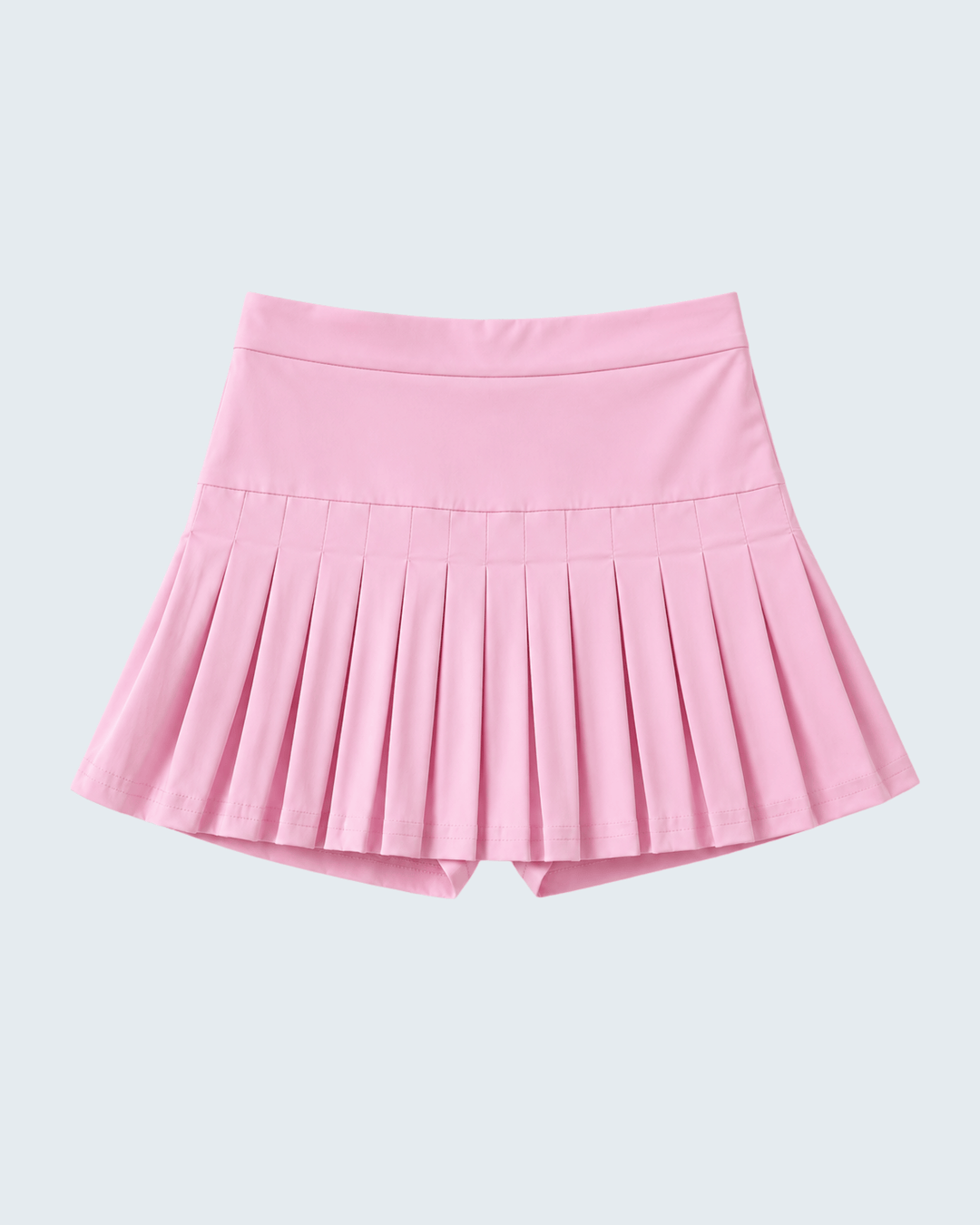 Pink pleated skirt on a light gray background