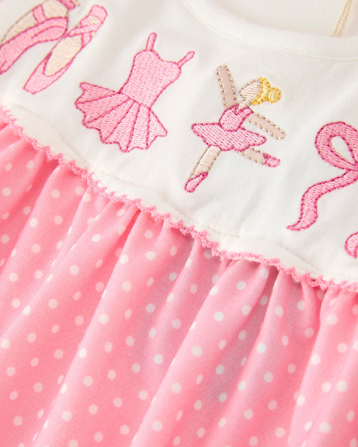 Cream embroidered ballet bodice and pink polka dot skirt with ruffle hem