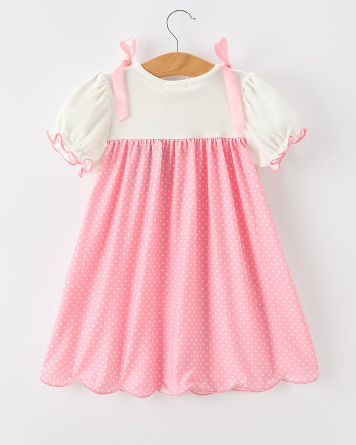 Pink polka dot dress with cream puff sleeves and pink bow shoulder straps