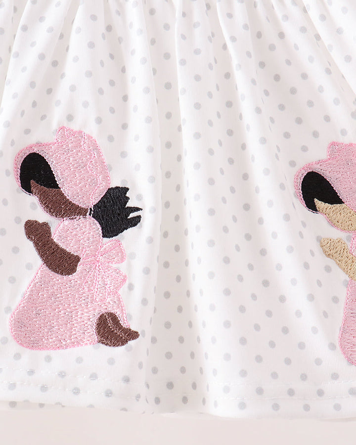 White dotted dress with pink embroidered angel appliques