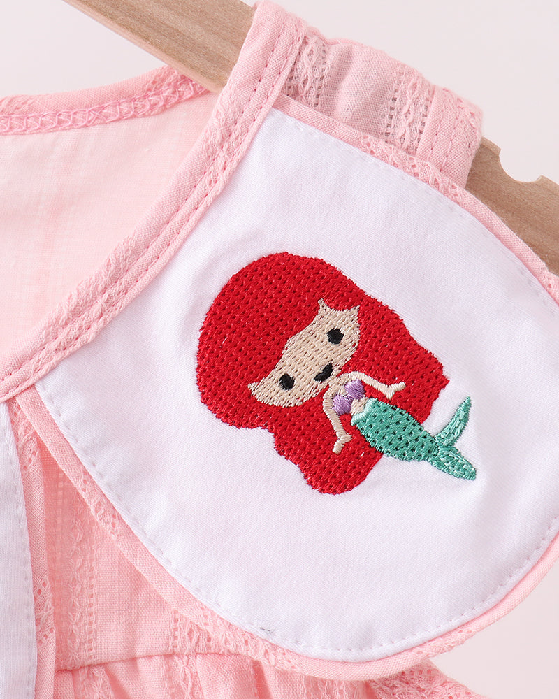 Pink dress with a mermaid patch on a white background