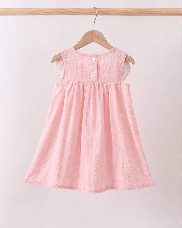 Pink dress hanging on a wooden hanger against a white background