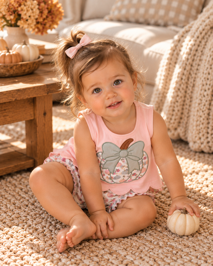 Pink pumpkin bow outfit on toddler: sleeveless top with matching bloomers