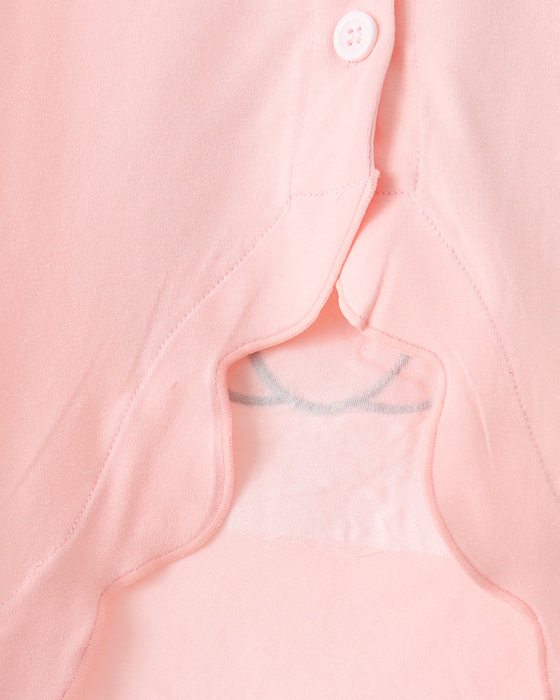Light pink top neckline with small button placket and scalloped trim