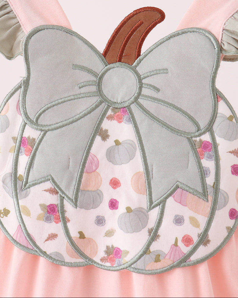 Pumpkin-print ruffle bubble with large bow and pumpkin applique