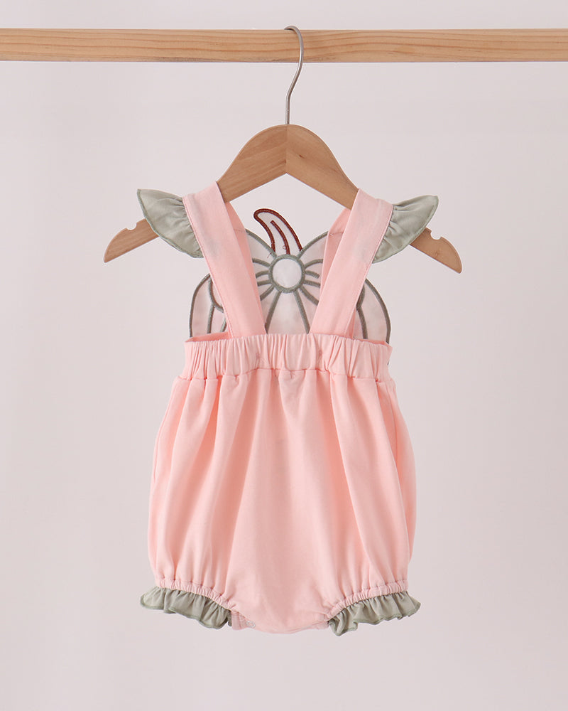Pink baby bubble romper with ruffle hem and bow-appliqué straps