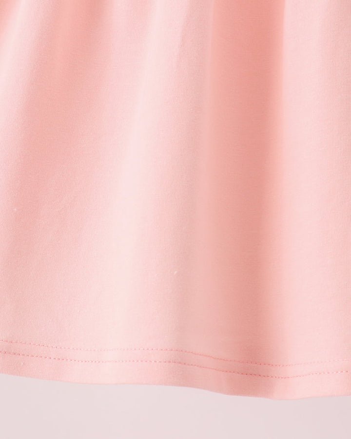 Pink skirt with neat hem stitching and gathered seam detail