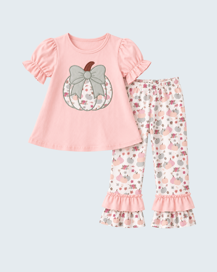 Pink short-sleeve top with pumpkin bow appliqué and floral ruffle pants set