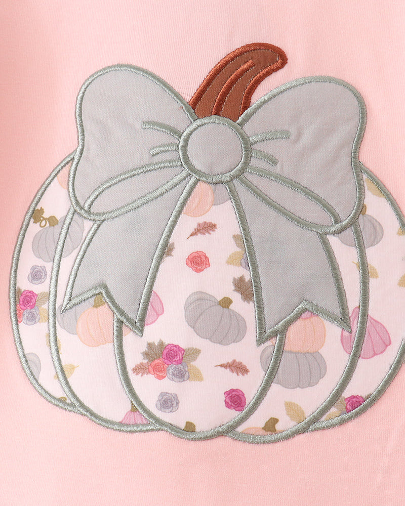 Pink pants set with pumpkin appliqué and large bow detail