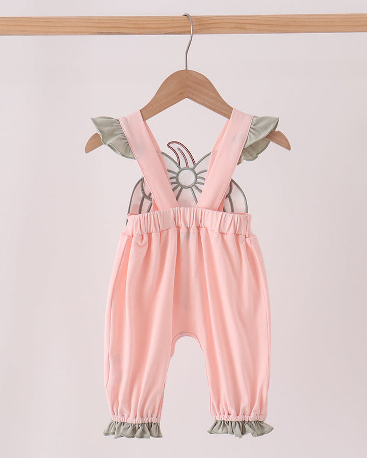 Pink baby romper with ruffled straps, bow appliqué back, and ruffle hems