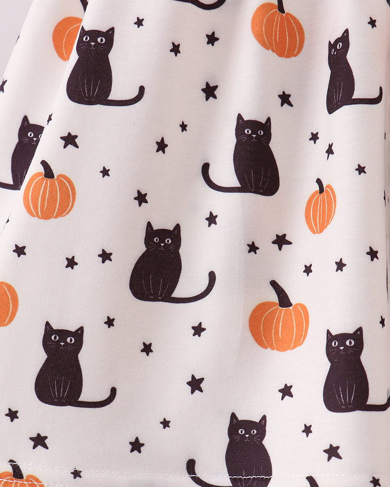 White fabric with a repeating Halloween print featuring black cats, orange pumpkins, and small black stars.