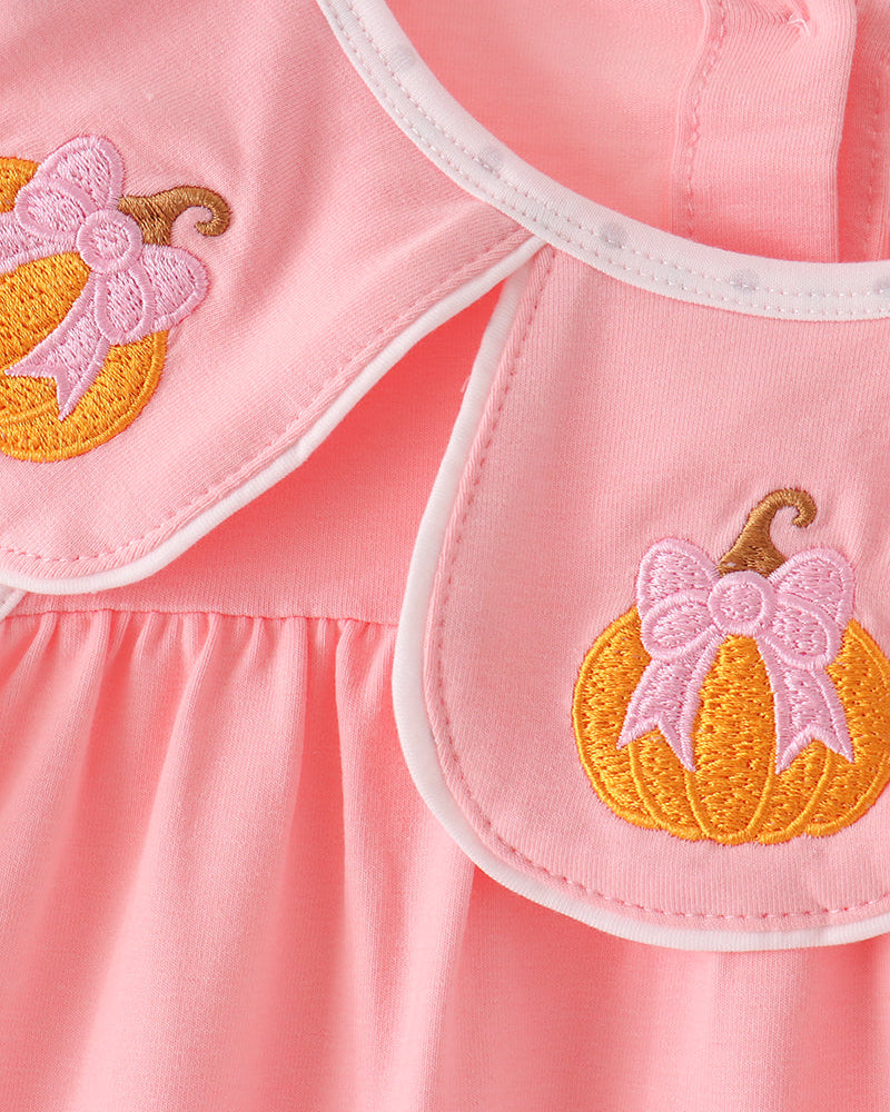 Pink dress with pumpkin embroidery and scalloped neckline trim