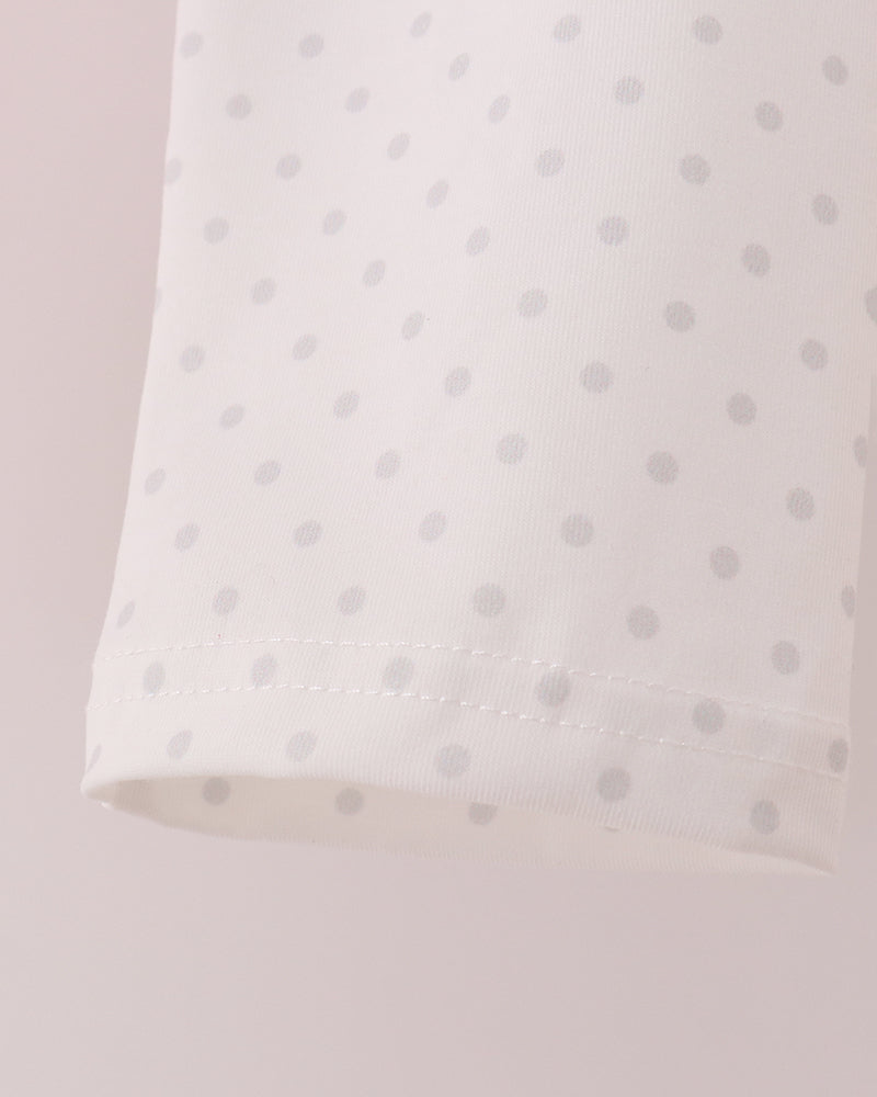Light pink dotted pants with elastic waistband and stitched hem
