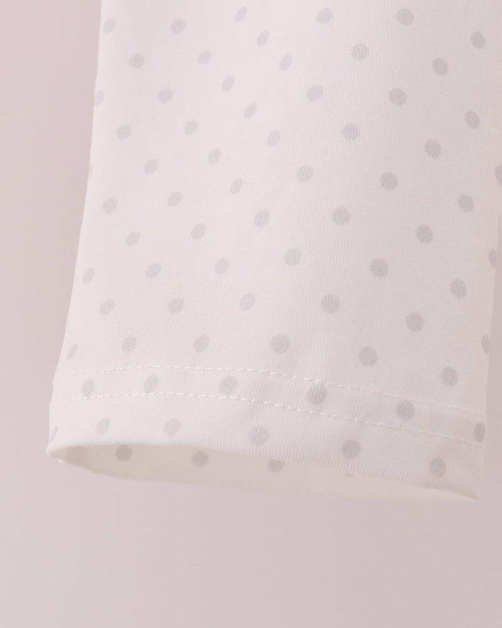 Light pink dotted pants with elastic waistband and stitched hem