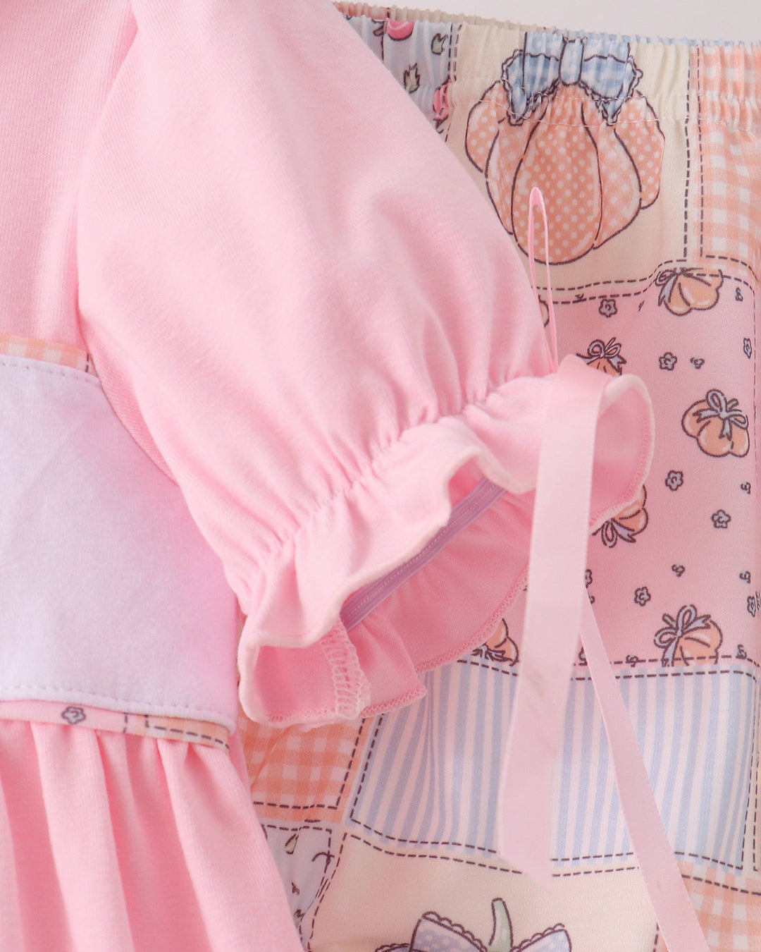 Pink blouse with elastic puff sleeves and matching patterned bloomer