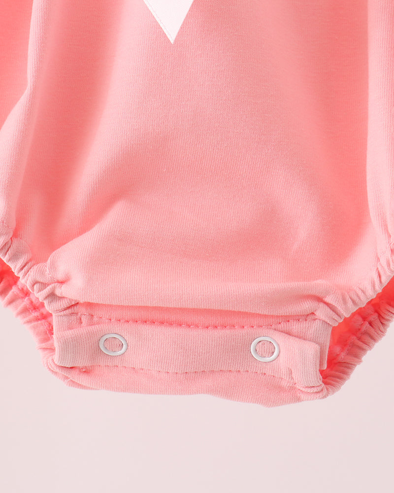 Pink baby bubble romper with snap-button closure and ruffled legs