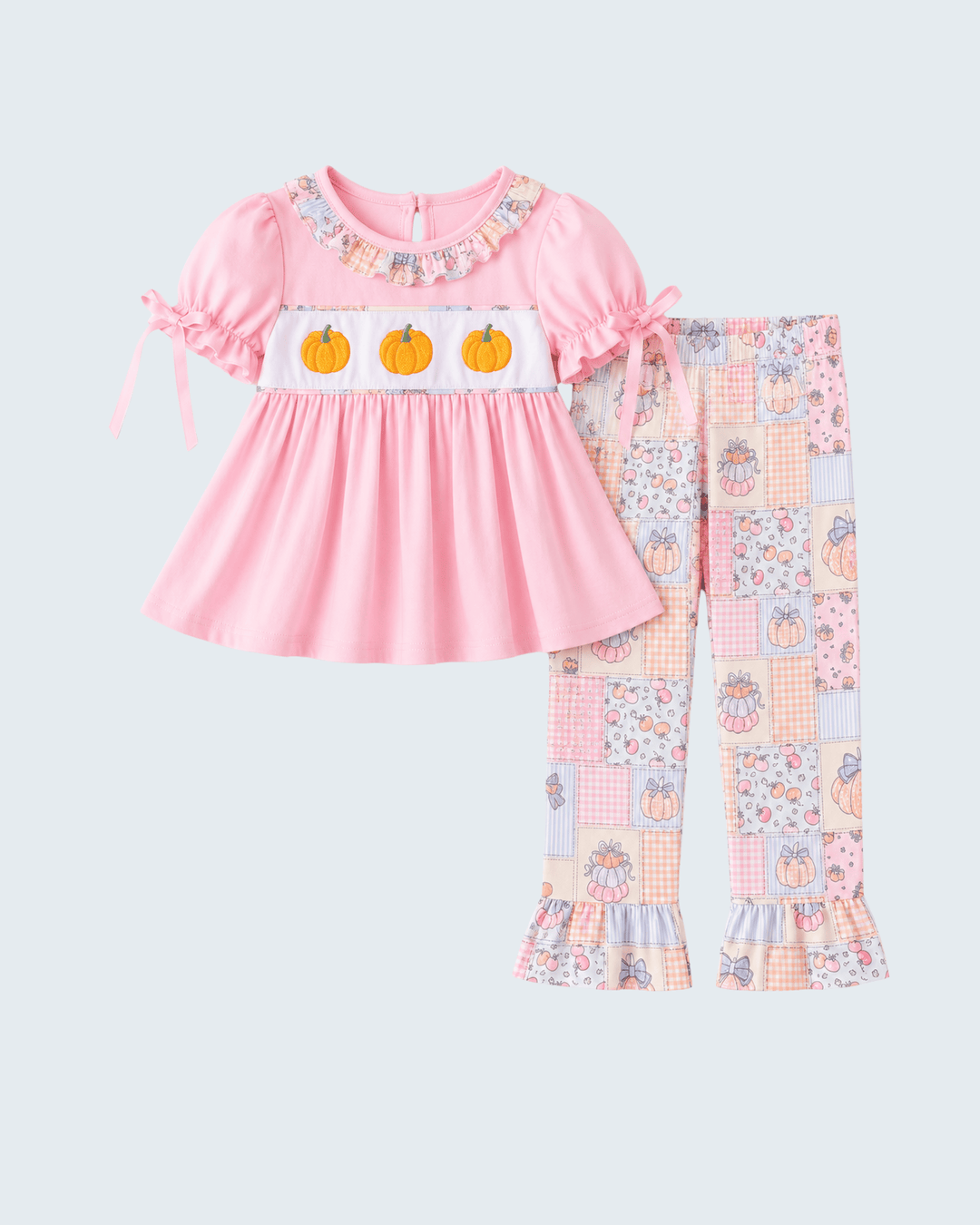 Pink ruffled top with pumpkin motif and patchwork pajama pants set