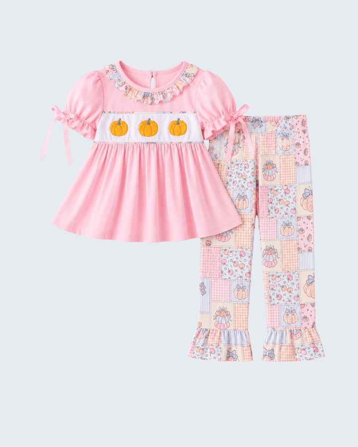 Pink ruffled top with pumpkin motif and patchwork pajama pants set