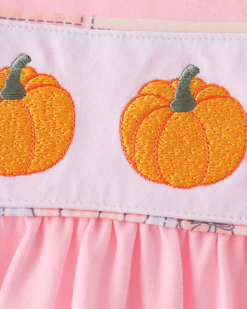 Pink pants with orange pumpkin embroidery and gathered ruffle hem