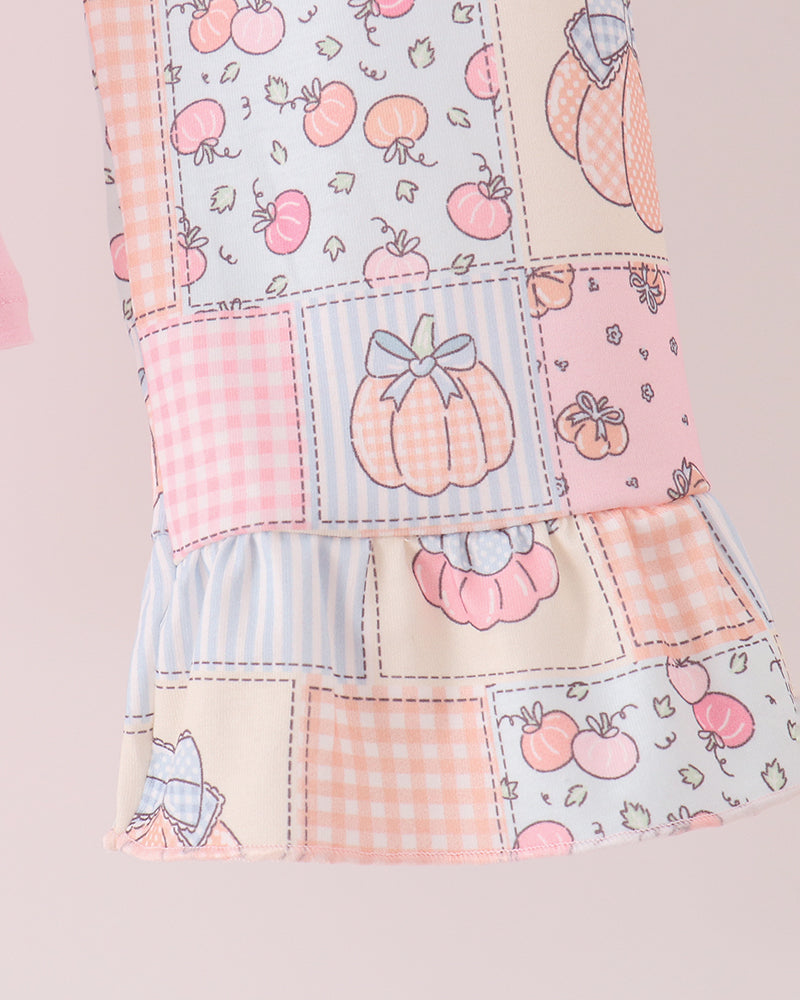 Patchwork pink pants with stitched prints and ruffle trim