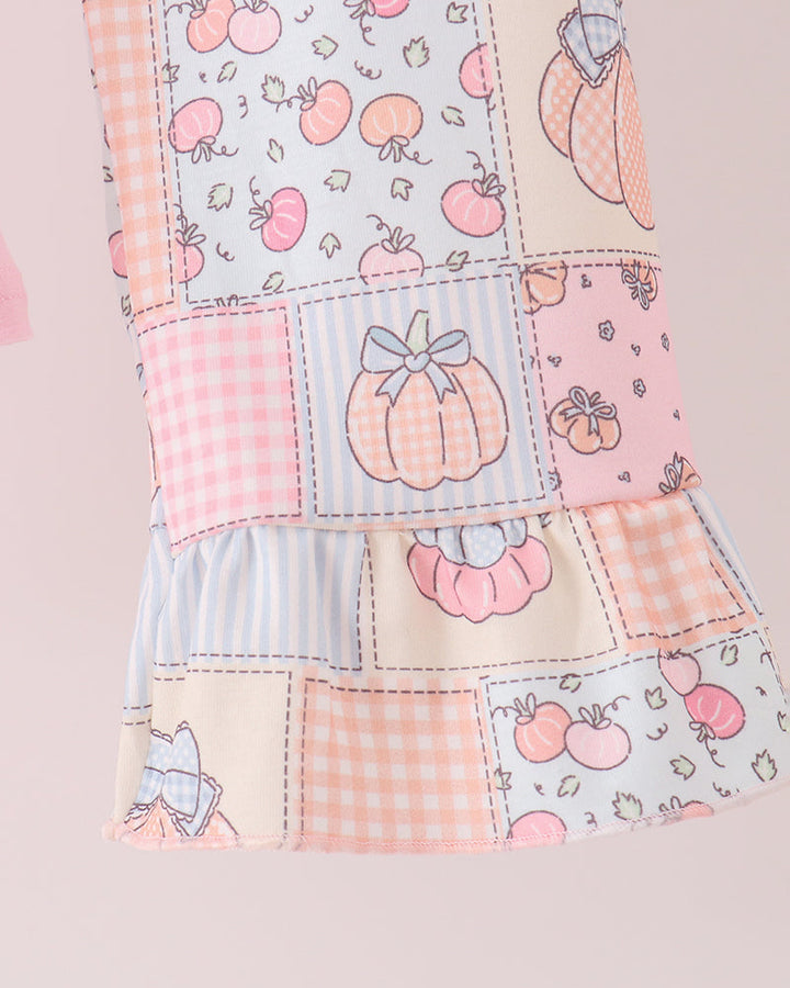 Patchwork pink pants with stitched prints and ruffle trim