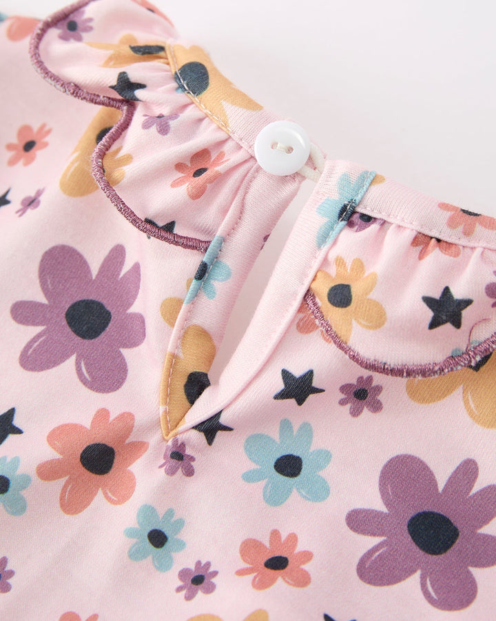 Pink floral baby top with small button closure at shoulder and ruffled collar