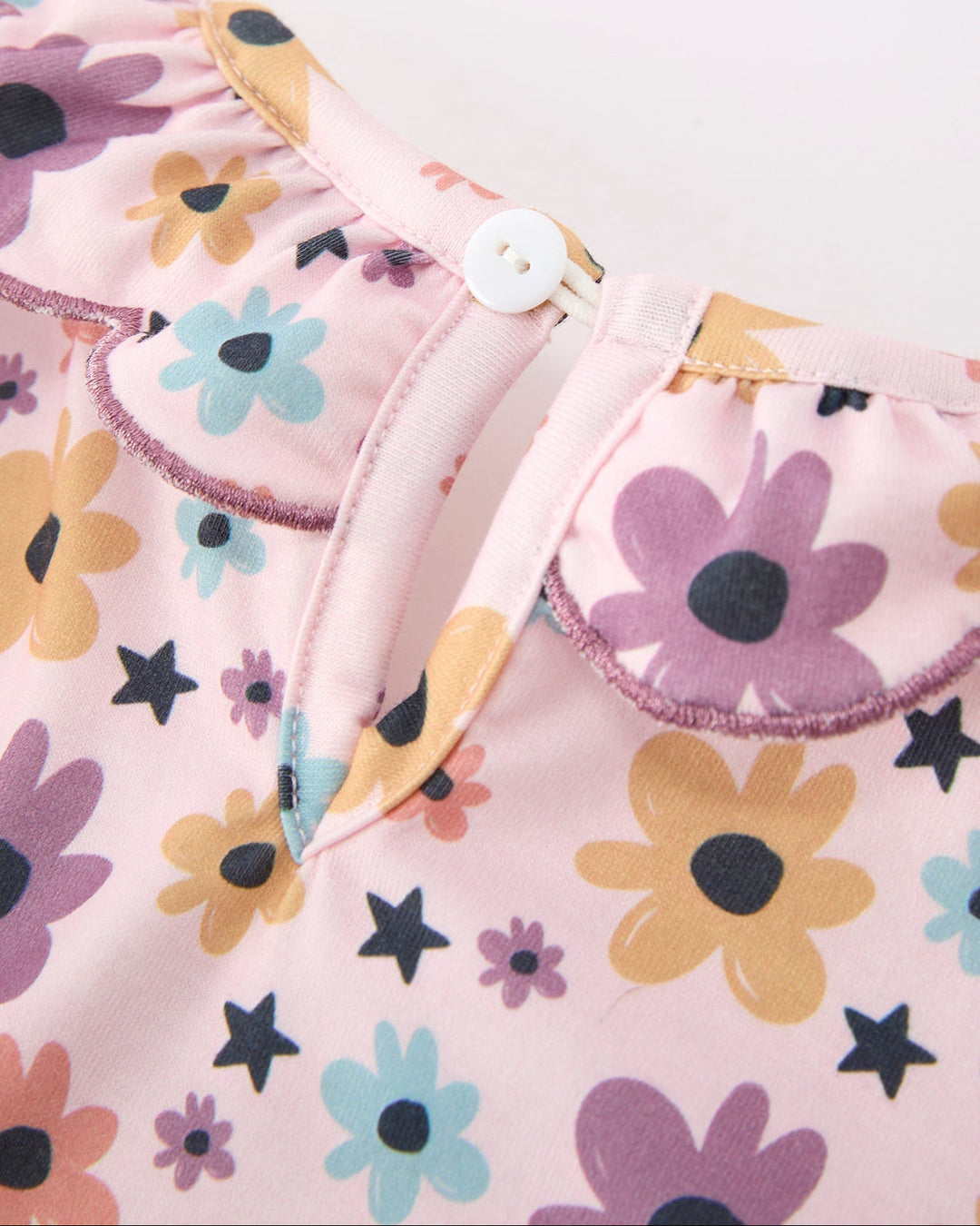 Girls light pink floral and star dress with buttoned front placket and scalloped neckline