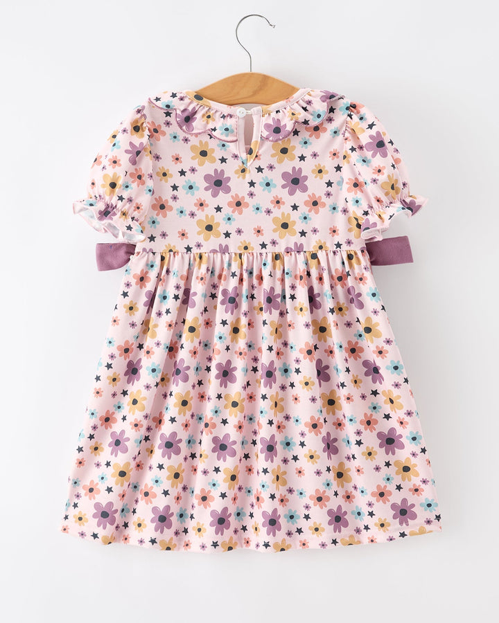 Girls light pink floral-and-star dress with short puff sleeves and lavender side bows
