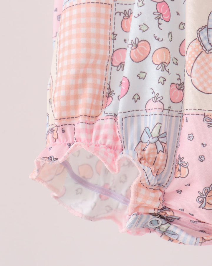 Pink-and-blue printed bubble romper with frilly elastic leg hem